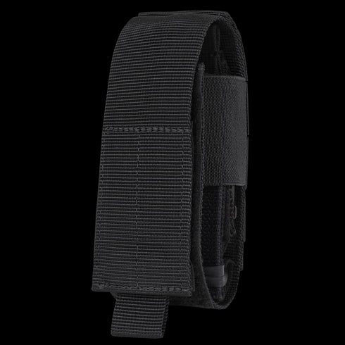 The Condor Universal TQ Pouch in black features a flap cover with hook-and-loop closure, is MOLLE compatible for easy attachment, and offers quick access to your tourniquet or small tools.